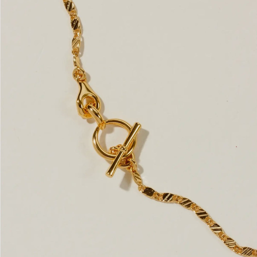 A84. Luna Norte 14k Gold Adorned Toggle Necklace