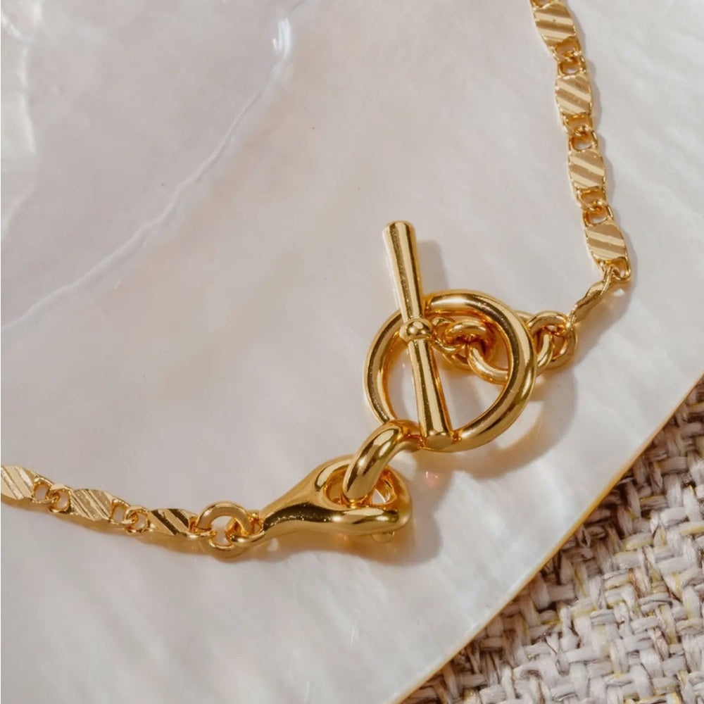 A84. Luna Norte 14k Gold Adorned Toggle Necklace