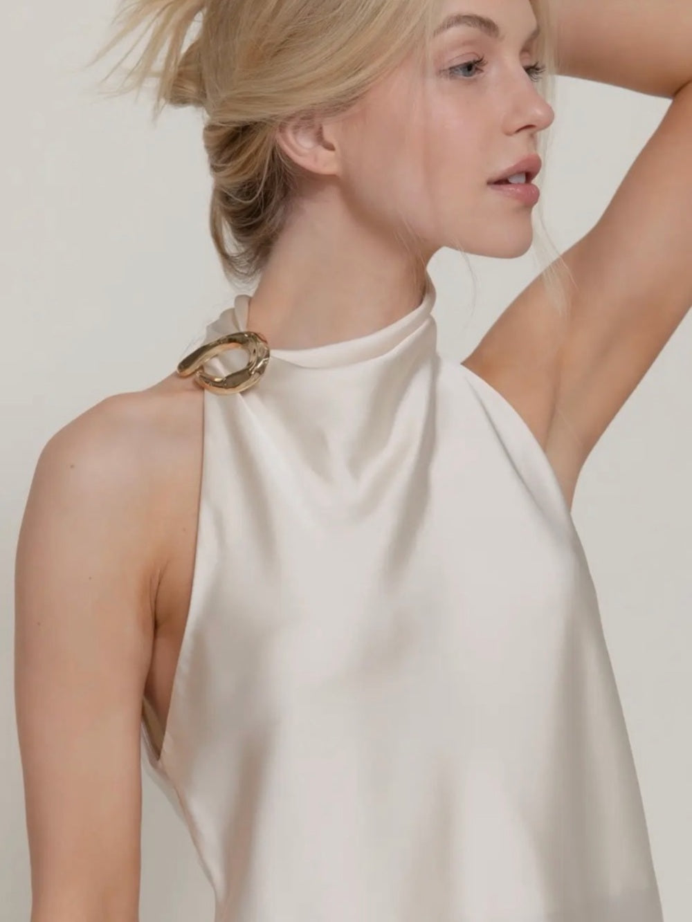A306. Ivory Halter Satin Top with Gold Ring Accent
