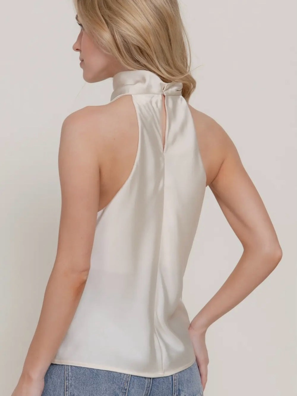 A306. Ivory Halter Satin Top with Gold Ring Accent