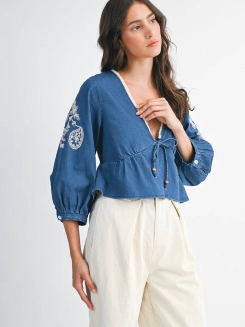 A380. Embroidered V-Neck Peplum Top - Blue