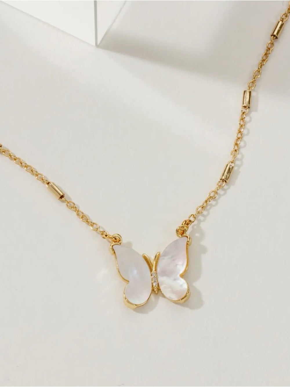 A387. Luna Norte Gold Butterfly Necklace with Mother-of-Pearl Wings