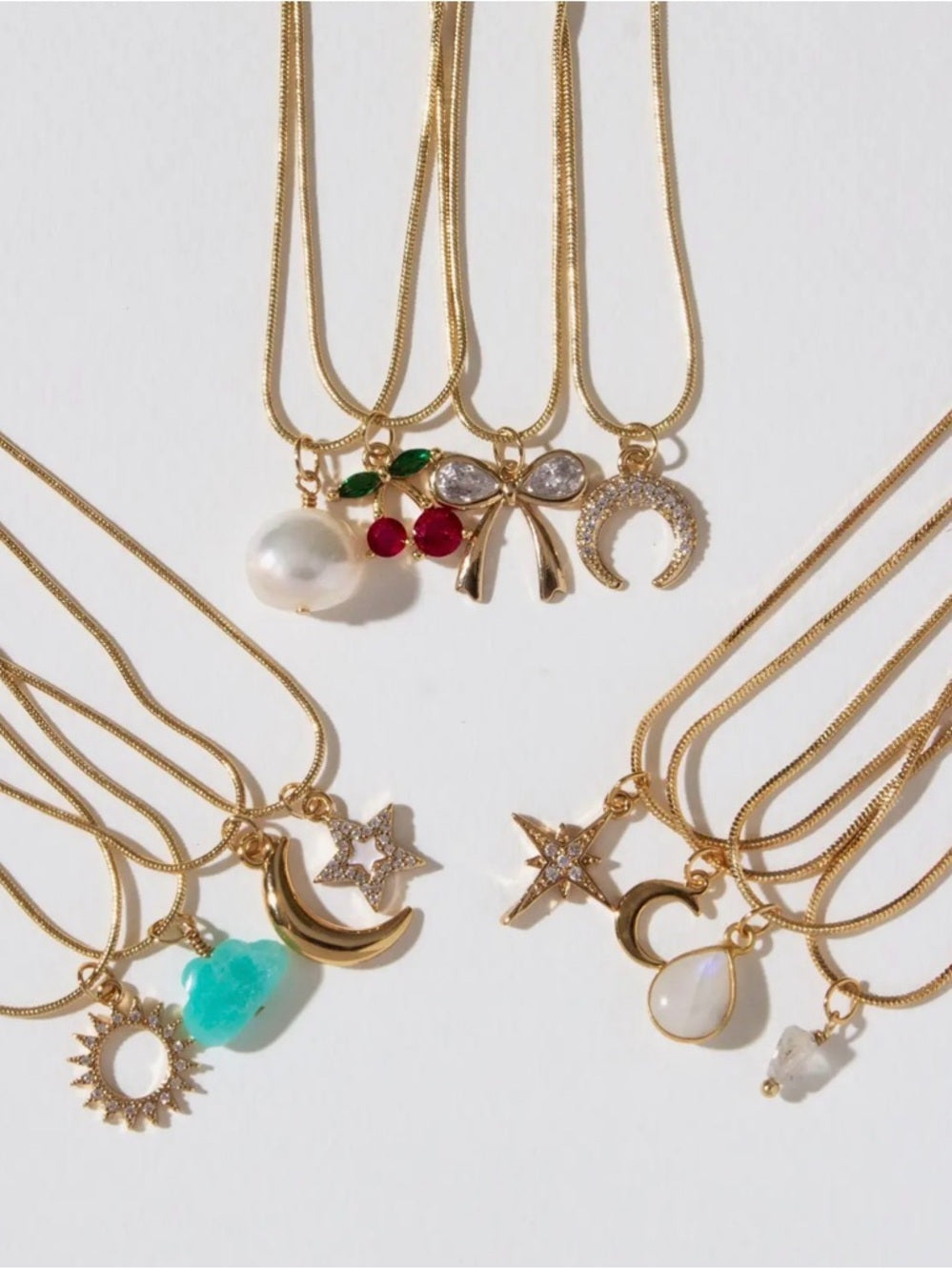 A394. Luna Norte Spring Gold 4 Strand Charm Necklace Set