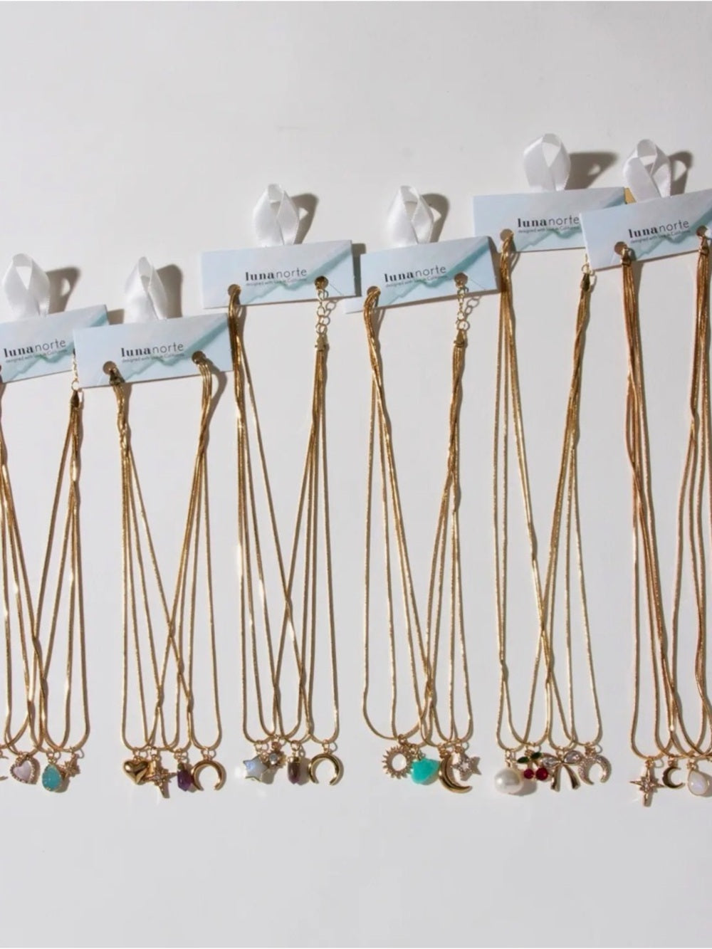 A394. Luna Norte Spring Gold 4 Strand Charm Necklace Set