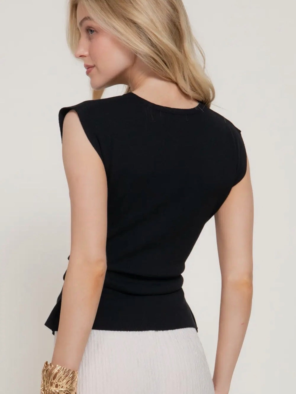 A444. Black Sleeveless Knit Top - Modern Peplum Detail