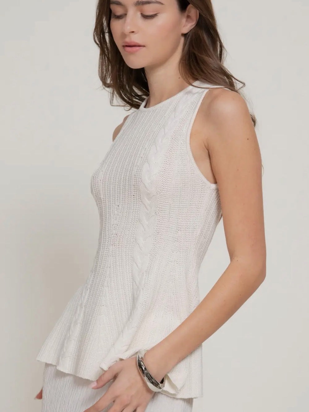 A445. Cream Sleeveless Cable Knit Peplum Top