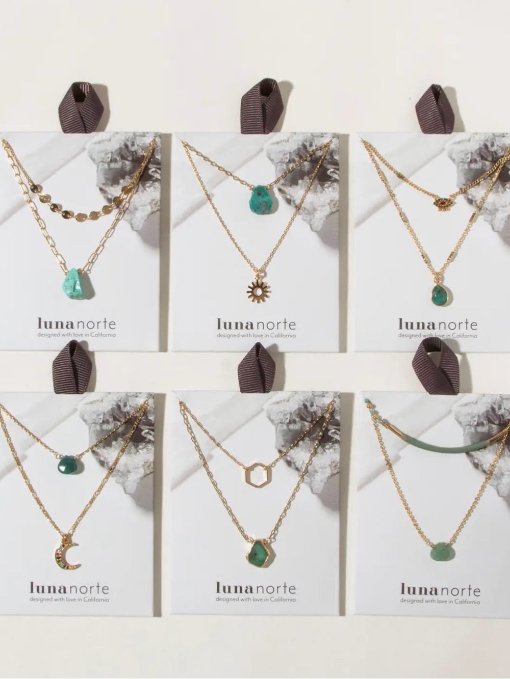 A460. Luna Norte Gold Necklace Set with Green Gemstone Accent