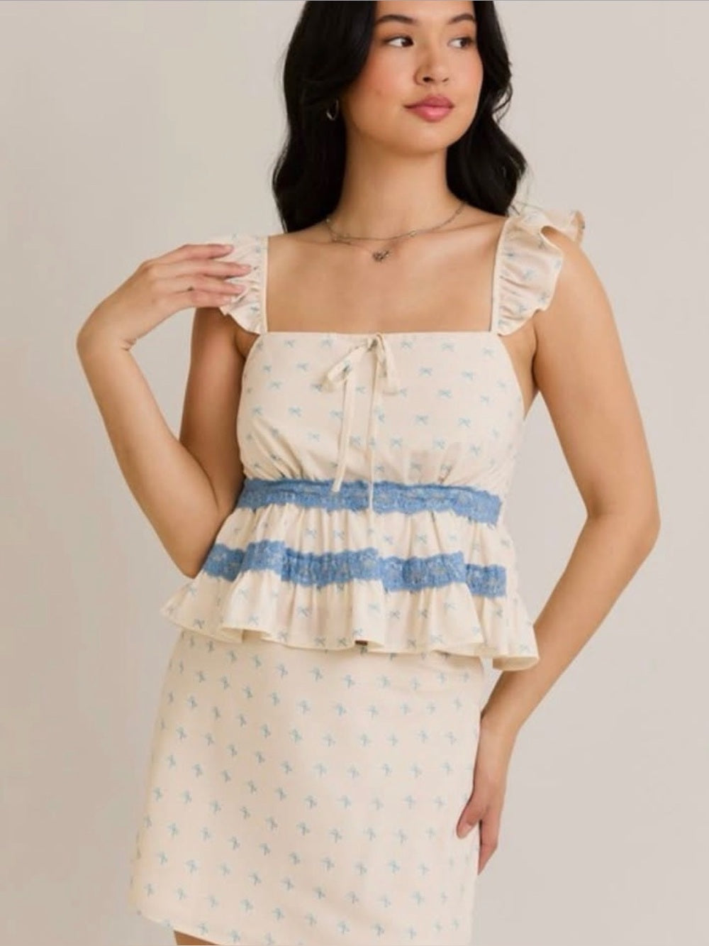 A624. Cream Skirt & Top Set with Blue Trim and Ruffle Straps