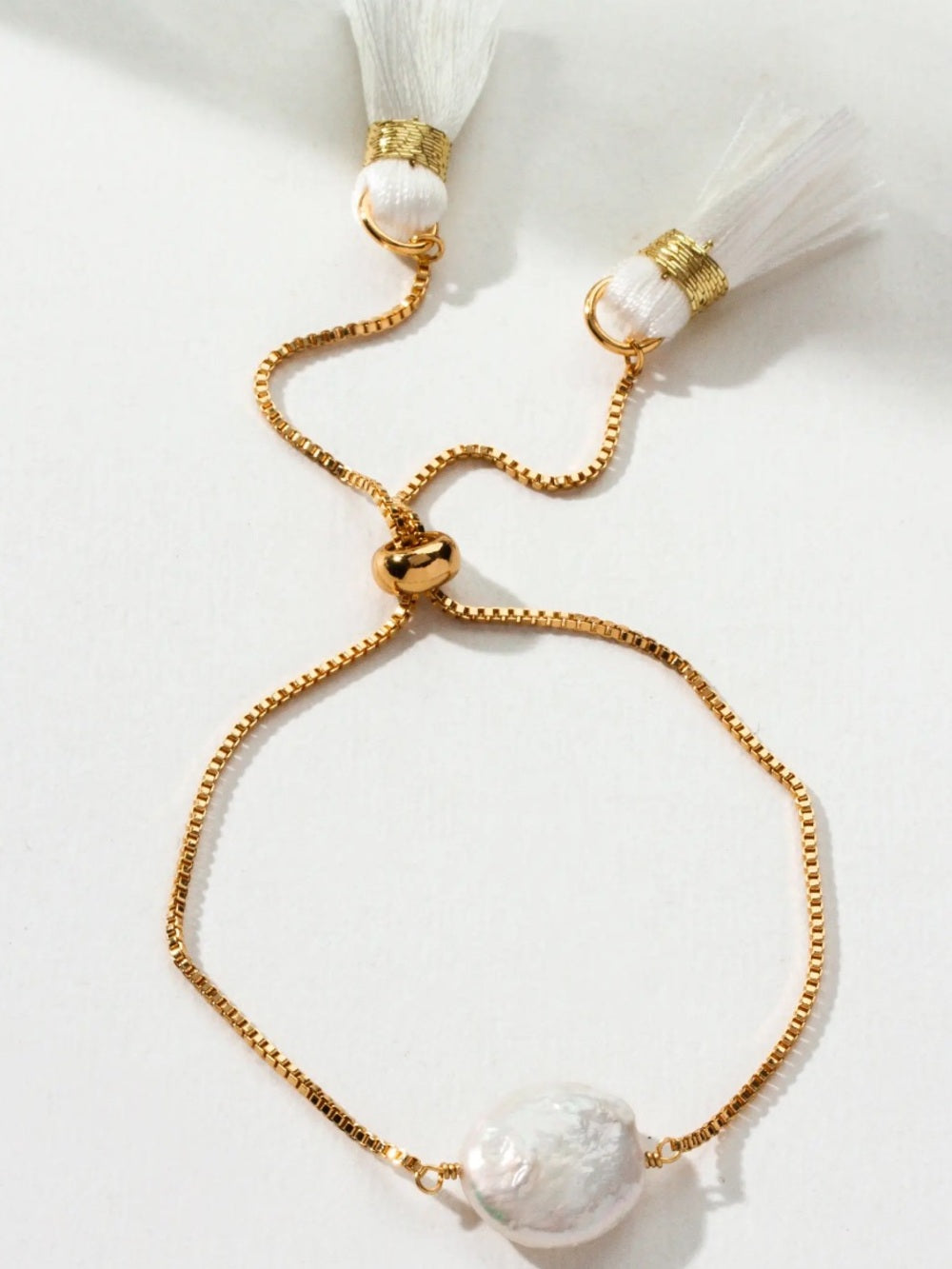 Luna Norte Gold Pearl Slider Bracelet with White Tassels