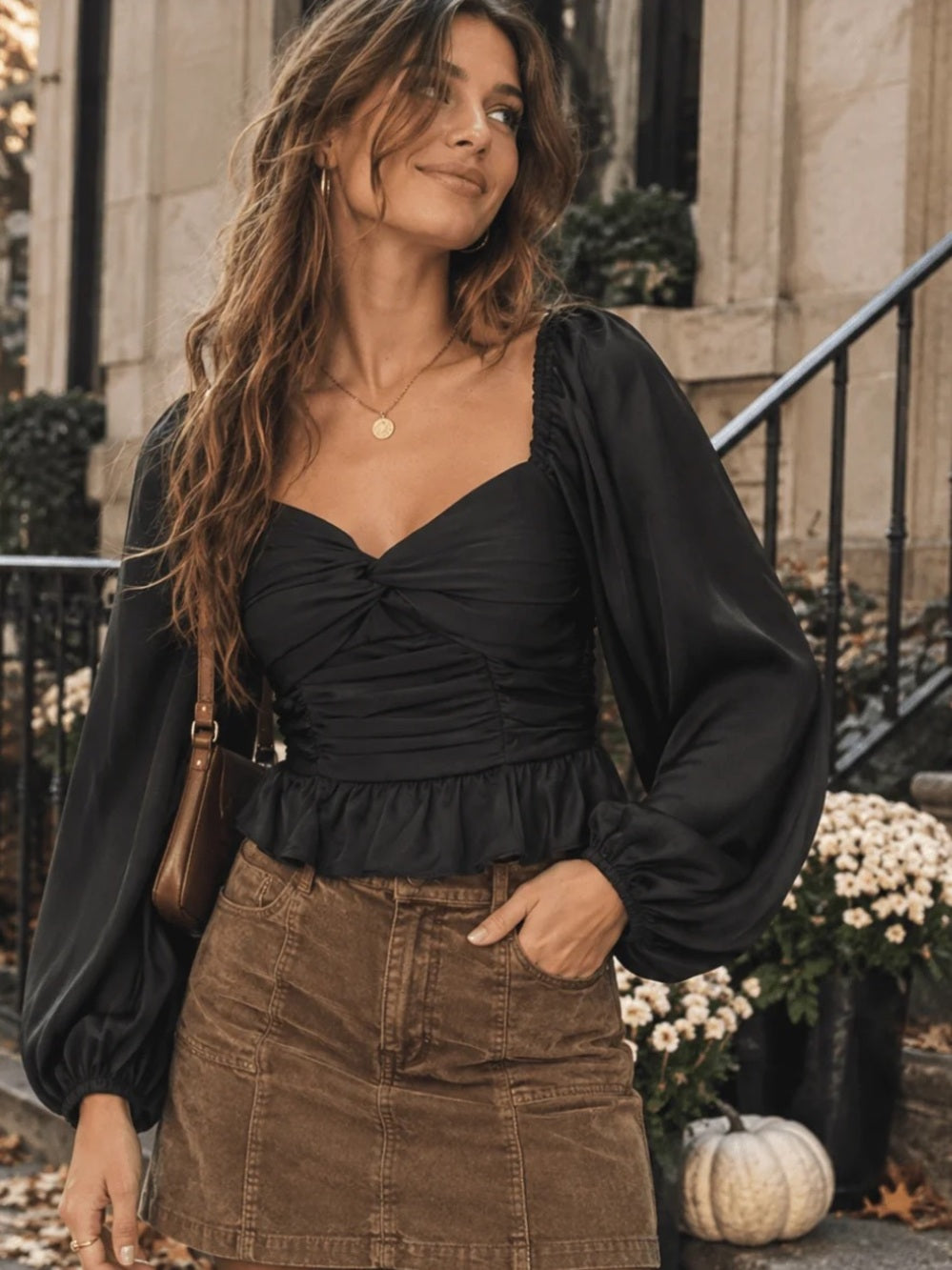 A641. Black Puff-Sleeve Ruched Peplum Top